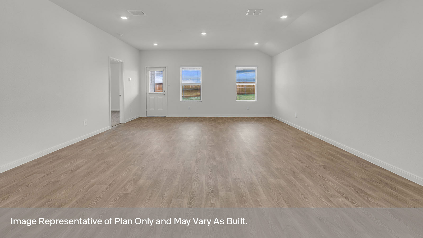 Dining room and living room with vinyl flooring and 3 windows.