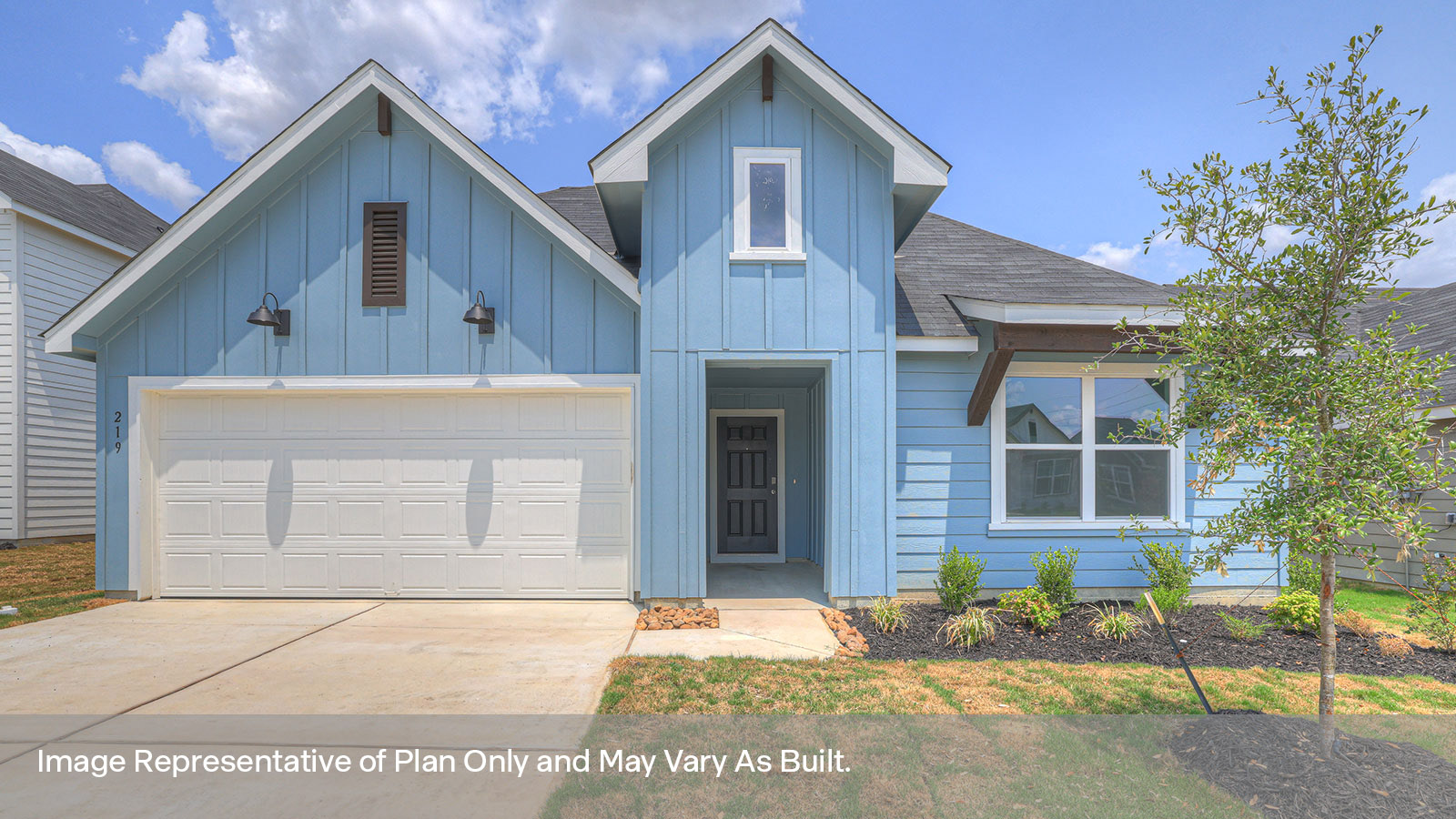 Single-story with farmhouse exteriors, one window, and 2 car garage.