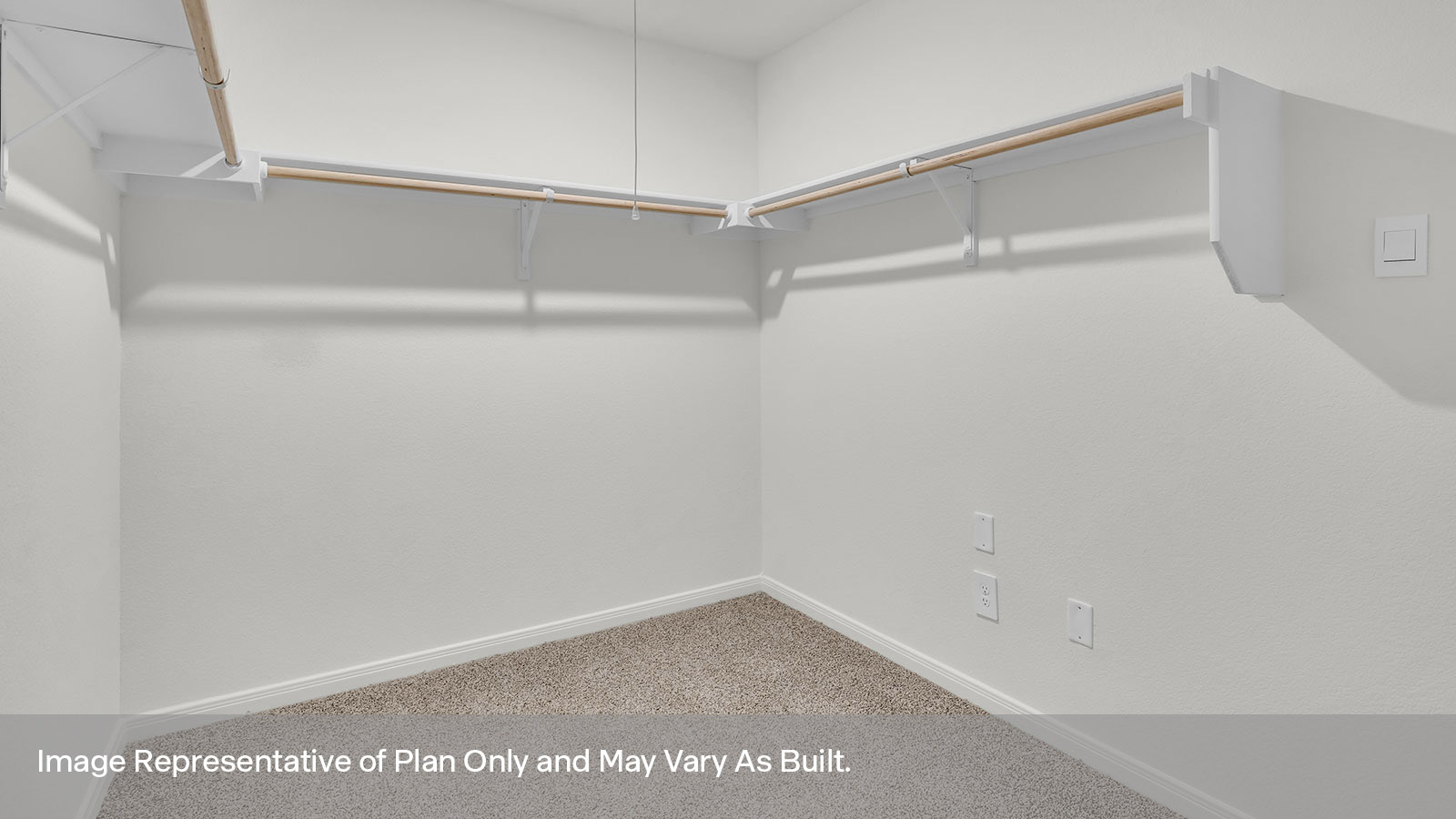 Large walk-in closet with wooden shelving.