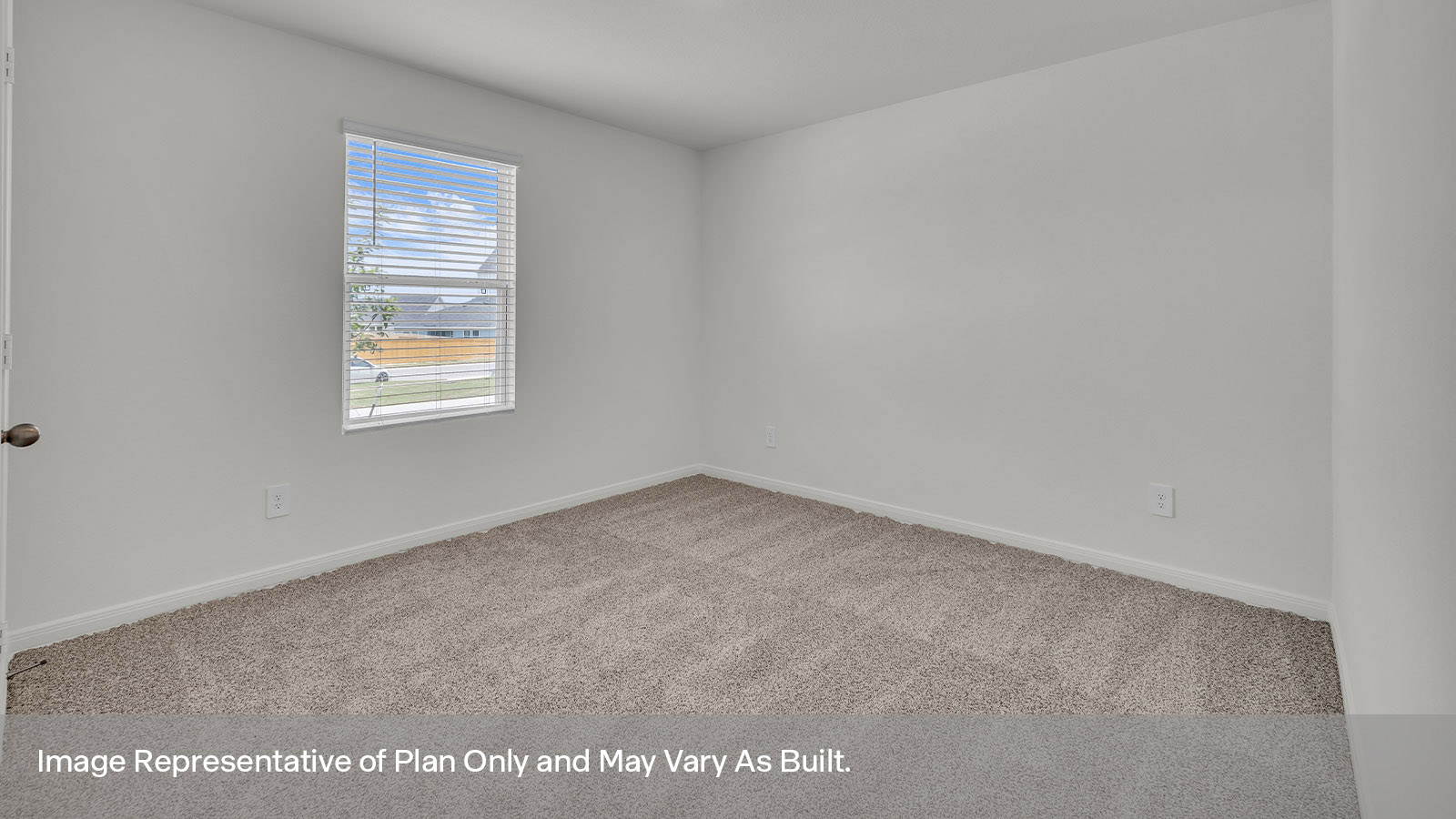 Front bedroom with carpeting and one window.
