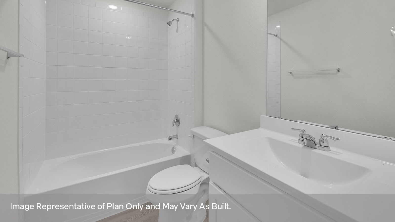Bathroom with single sink vanity, toilet, and tile surround with tub/shower combo.