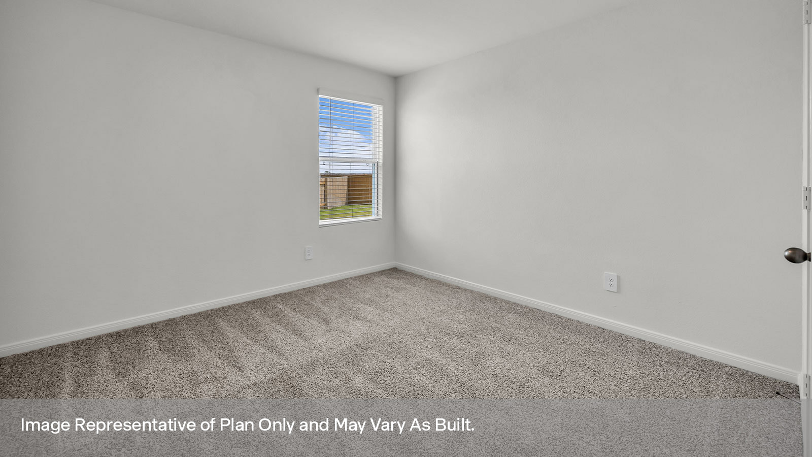 Bedroom with carpeting and one window.
