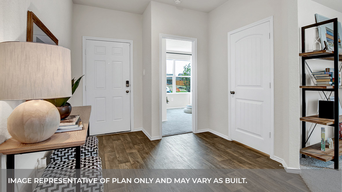 Entryway with vinyl flooring and front door.
