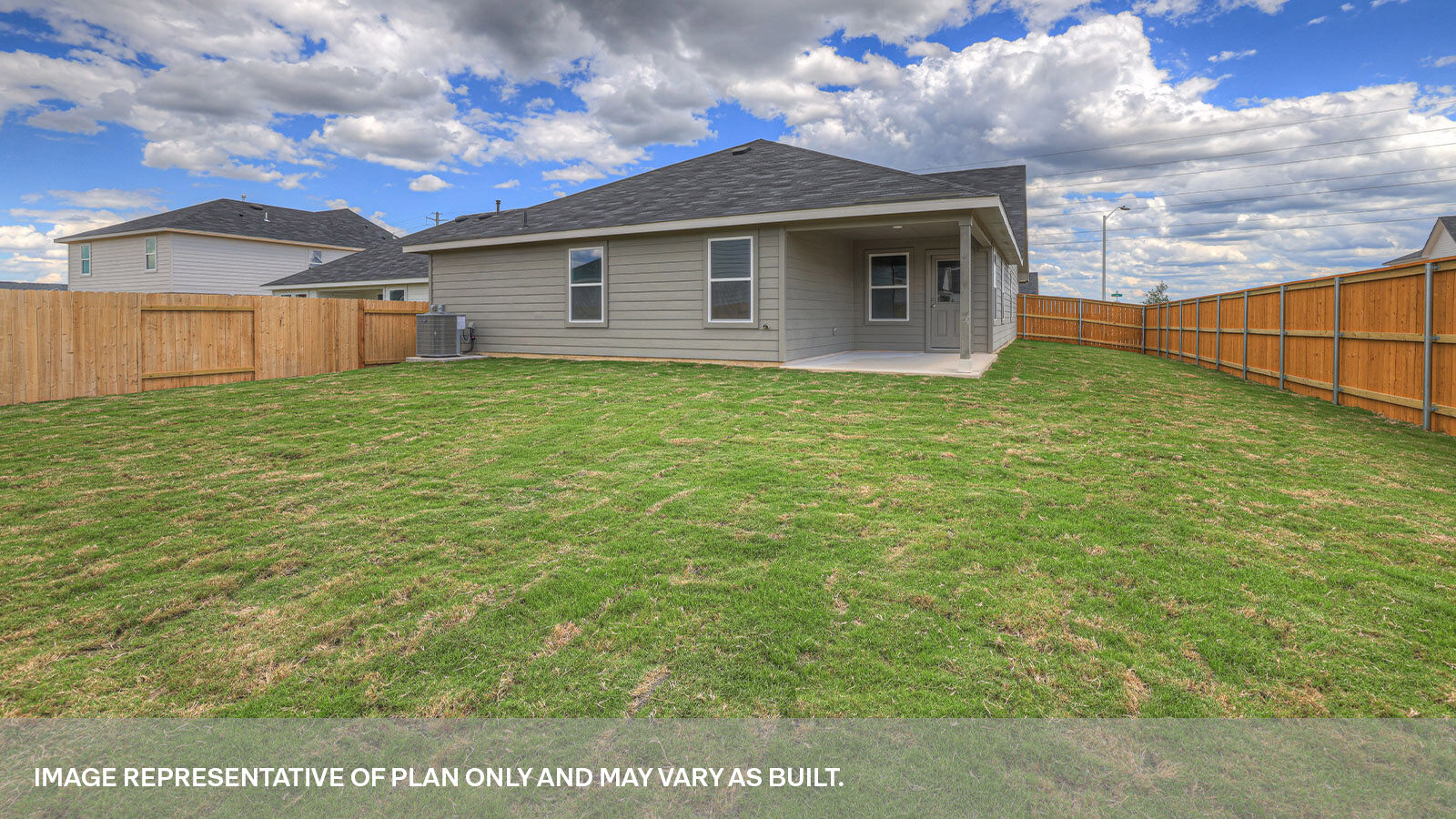 Covered patio with fully sodded backyard and privacy fence.