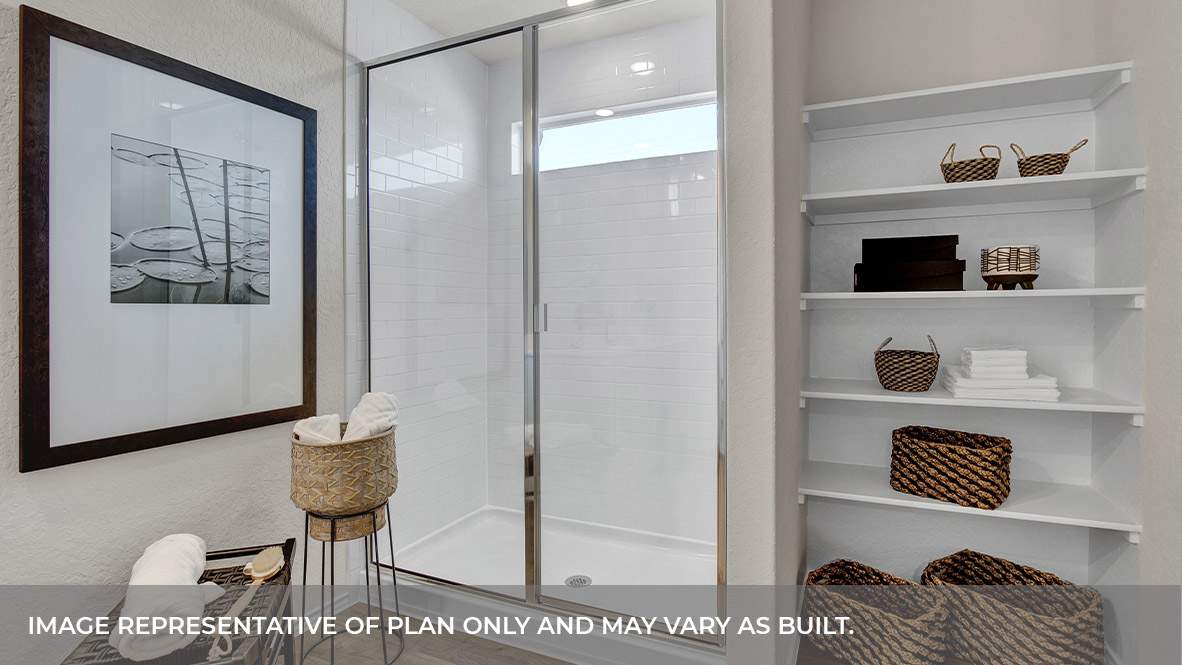Main bathroom with walk-in shower and wooden shelving.