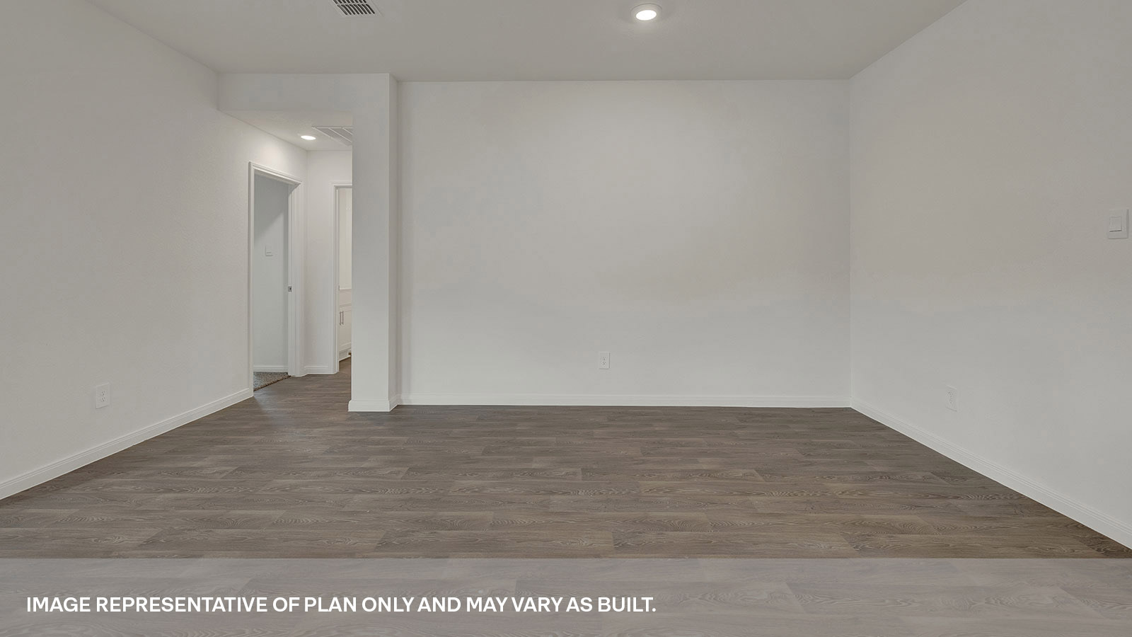 Dining room with vinyl flooring and bedroom hallway.