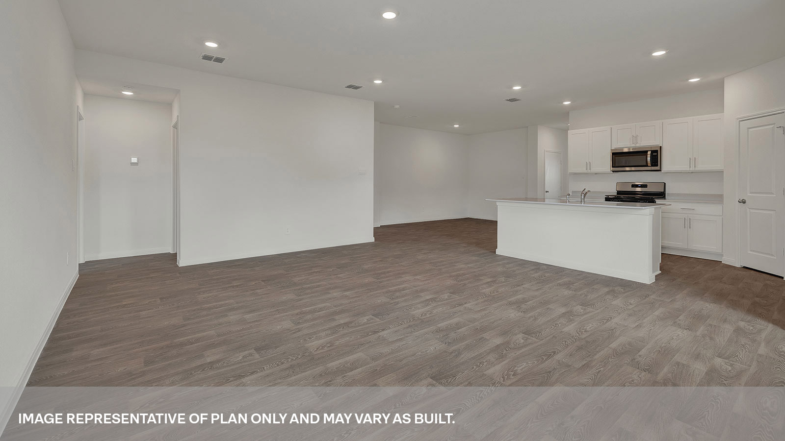Living room with vinyl flooring, 3 windows, and half lite exterior door.