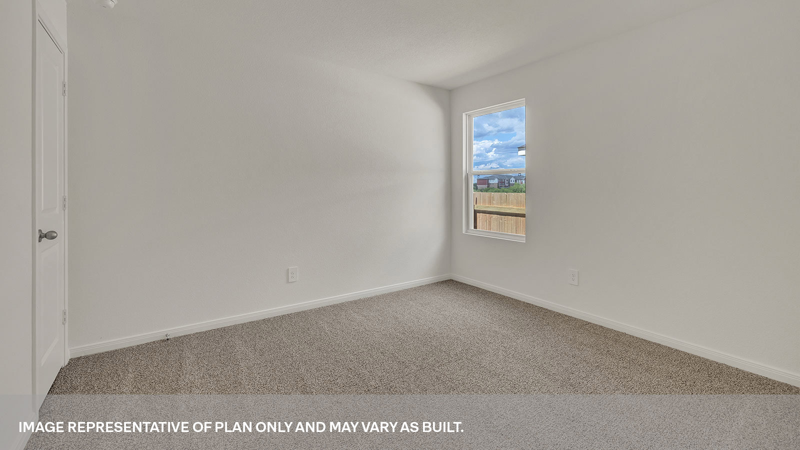 Bedroom with carpeting and one window.
