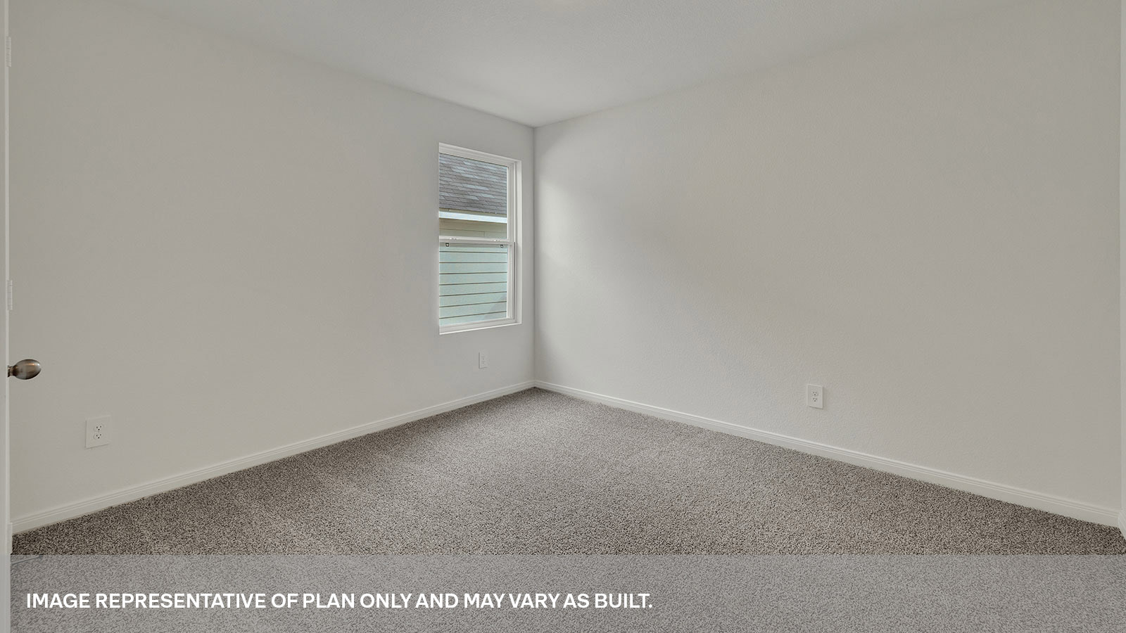 Bedroom with carpeting and one window looking into the side yard.