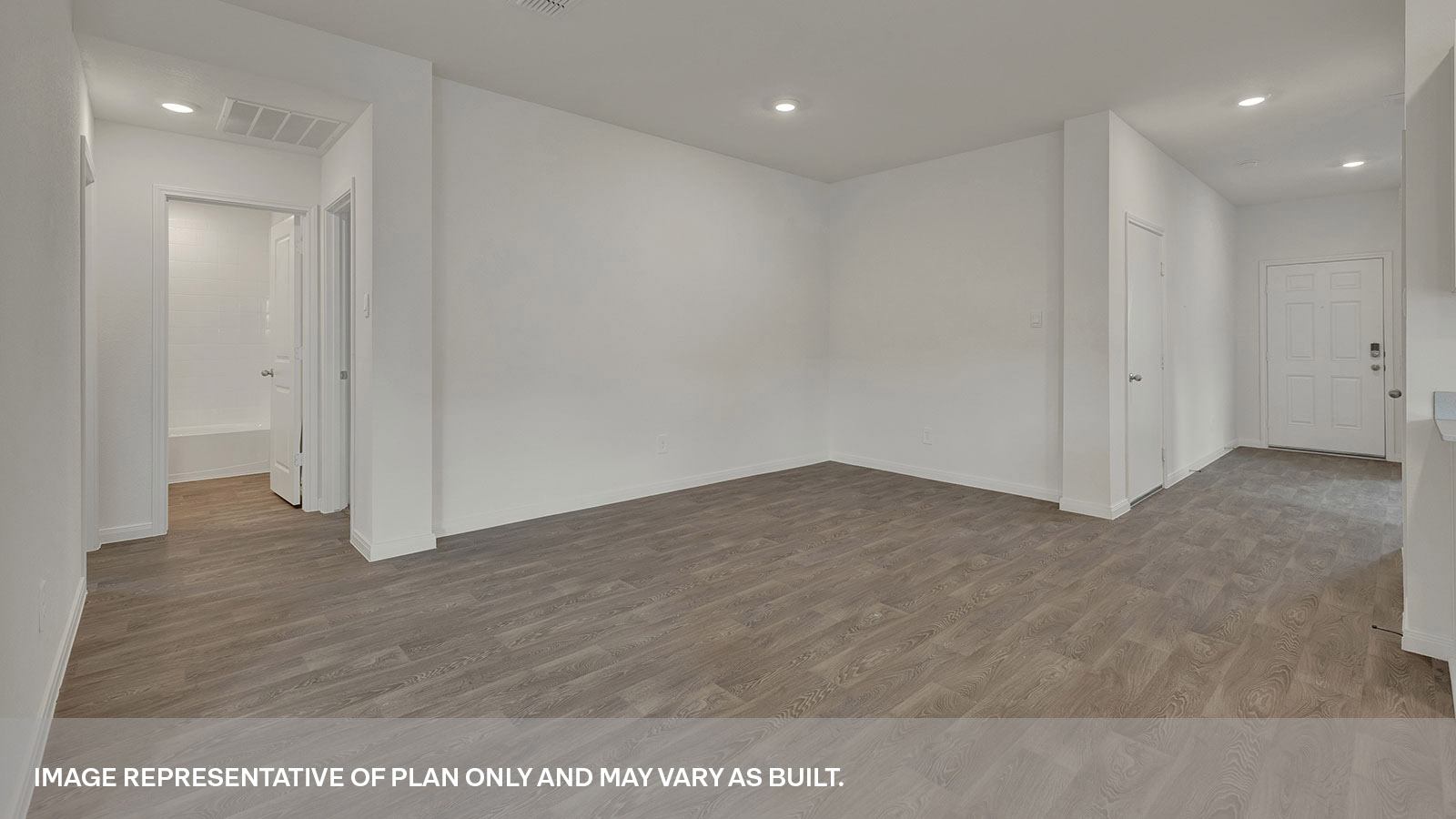 Dining room with vinyl flooring and entry hallway.