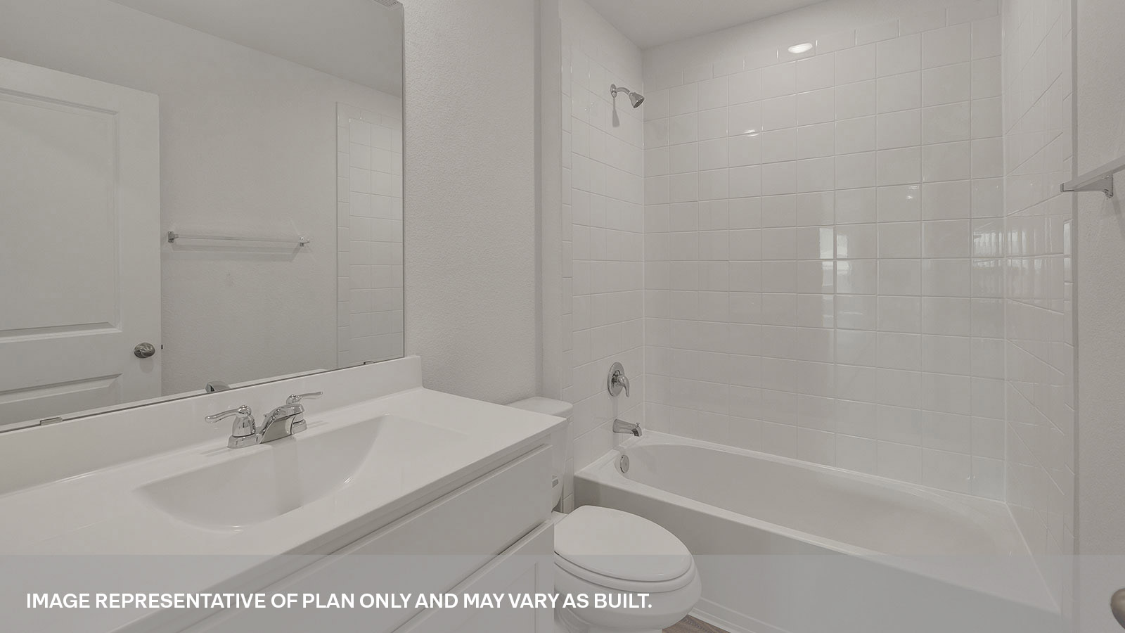 Hall bathroom with single sink vanity, toilet, and tub.