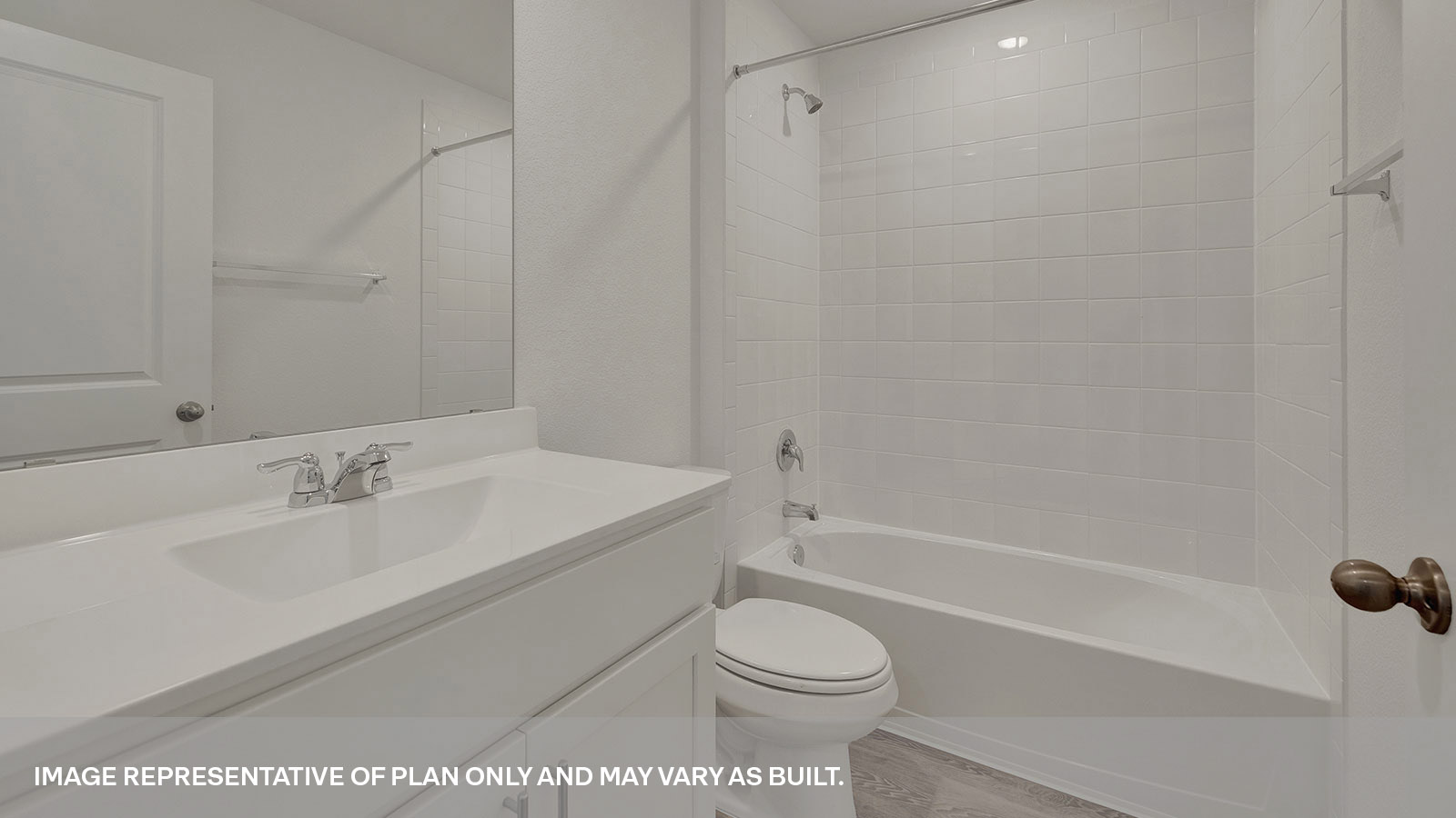 Hall bathroom with single sink vanity, toilet, and tub.