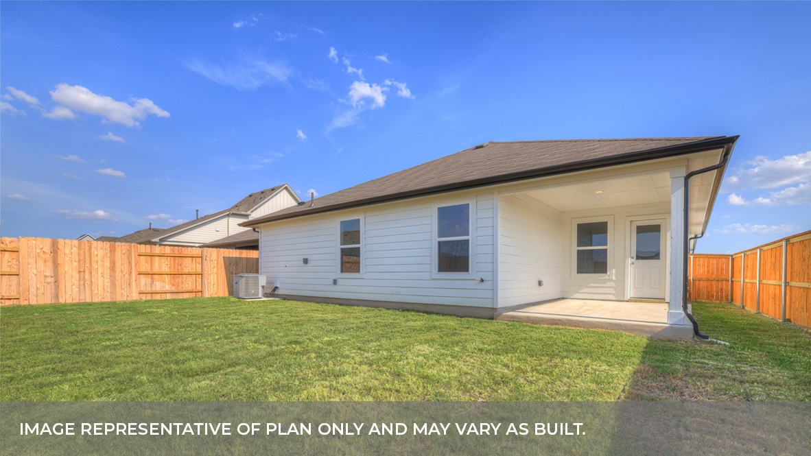 Covered patio with sod and privacy fence.