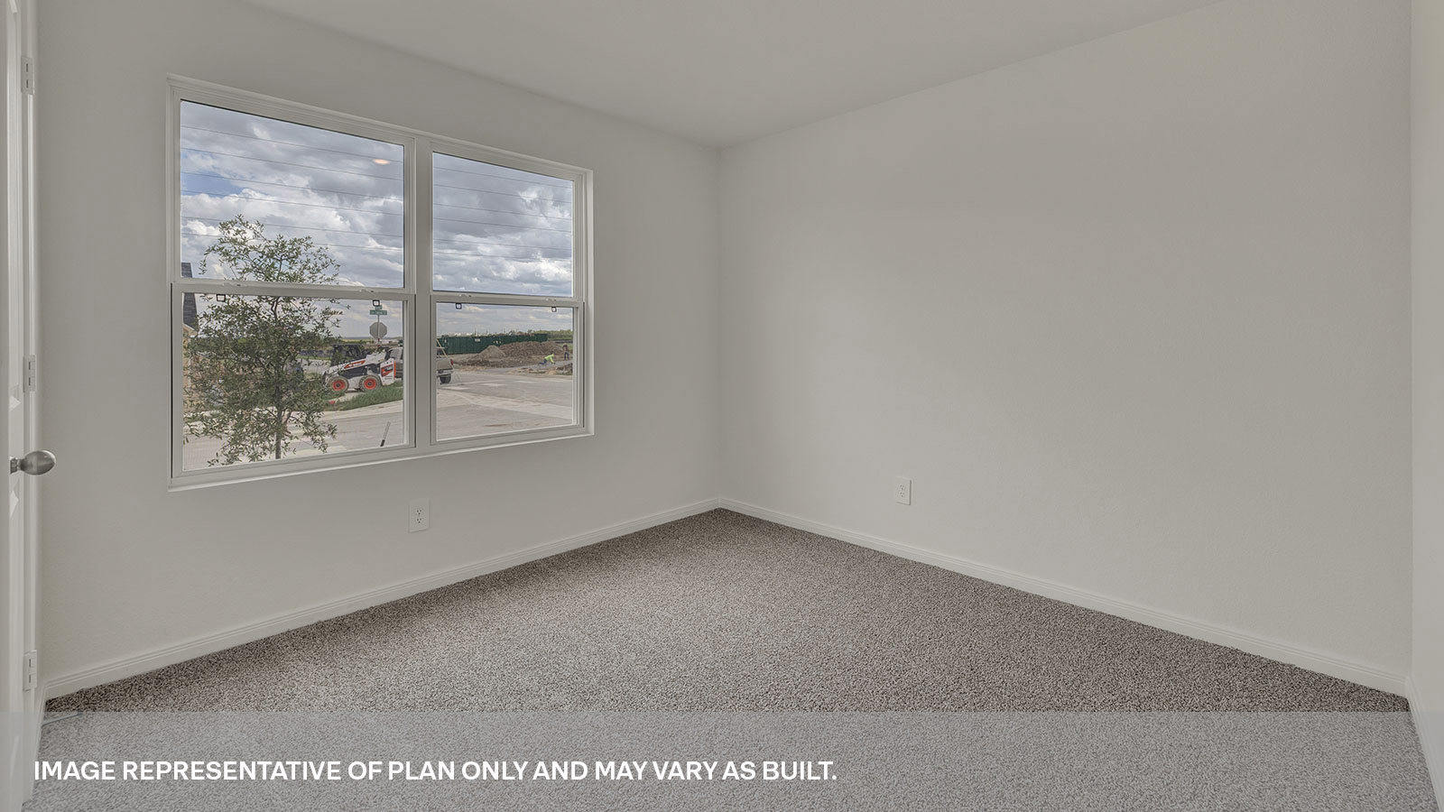 Front bedroom with carpeting and two windows.