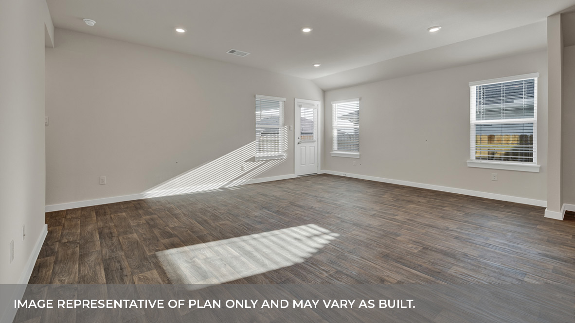 Living room with vinyl flooring and two windows.