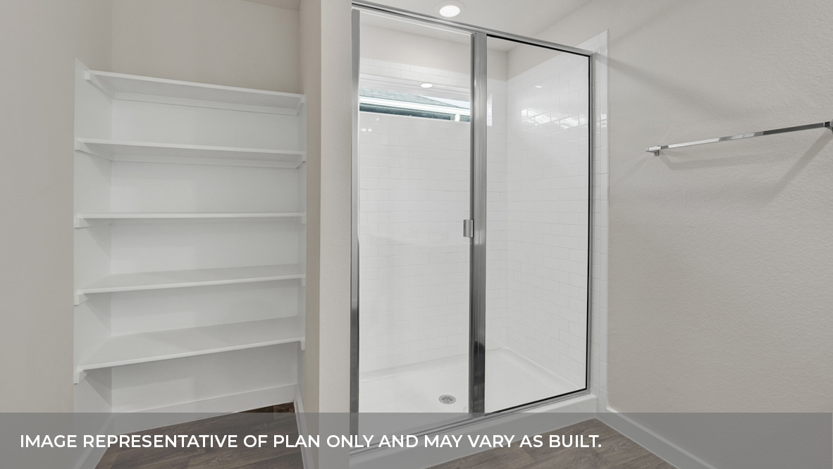 Large walk-in shower with wooden shelving.