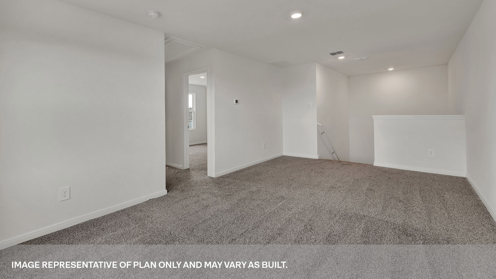 2nd story loft with carpeting and staircase.