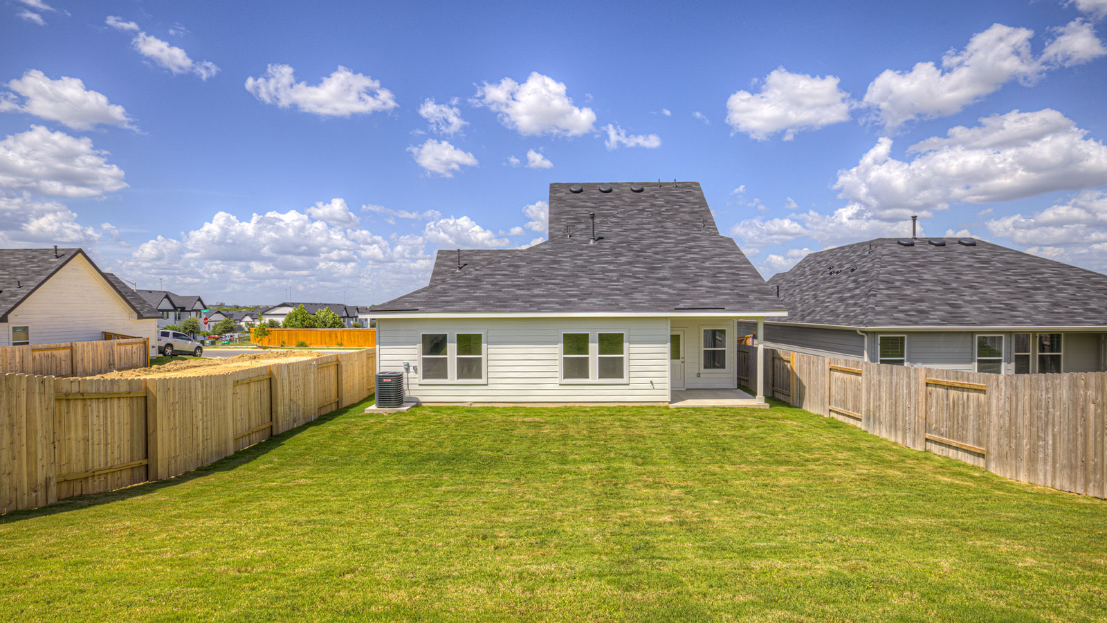 Fully sodded backyard with privacy fence.