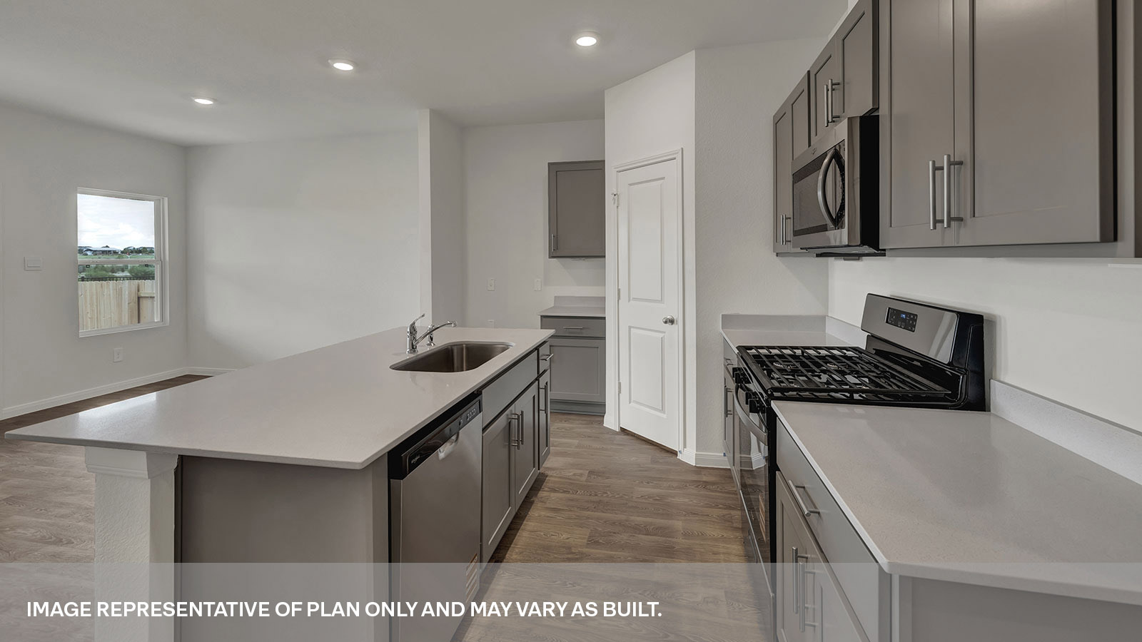 Kichen with kitchen island and stainless steel appliances.