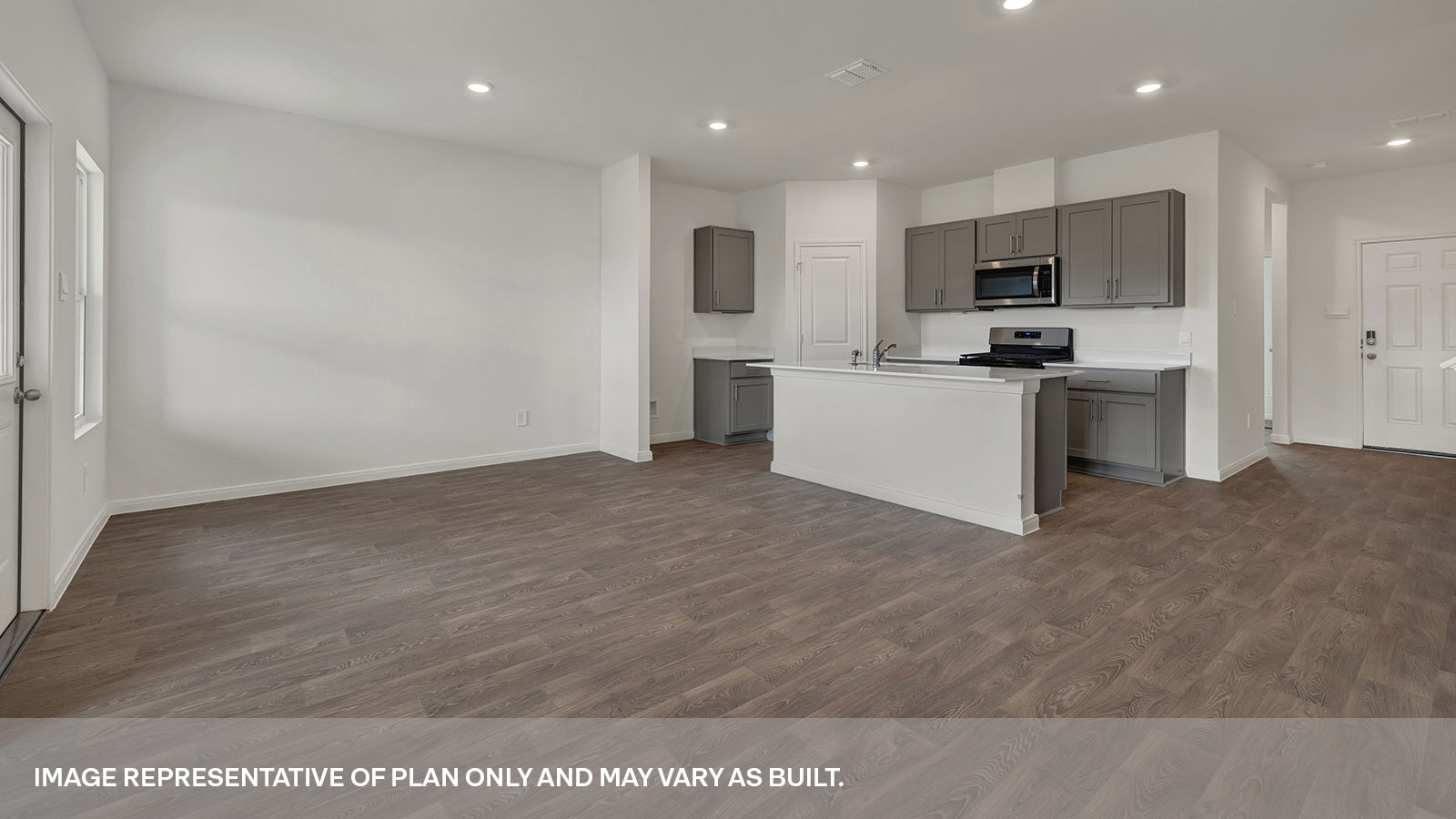 Dining room opening to the kitchen and entry hallway.