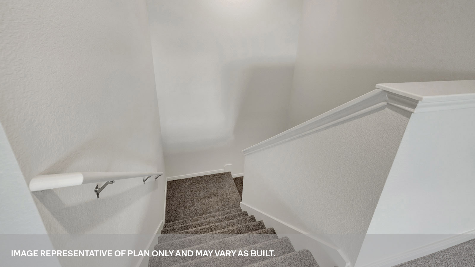 2nd story loft with carpeting and staircase.