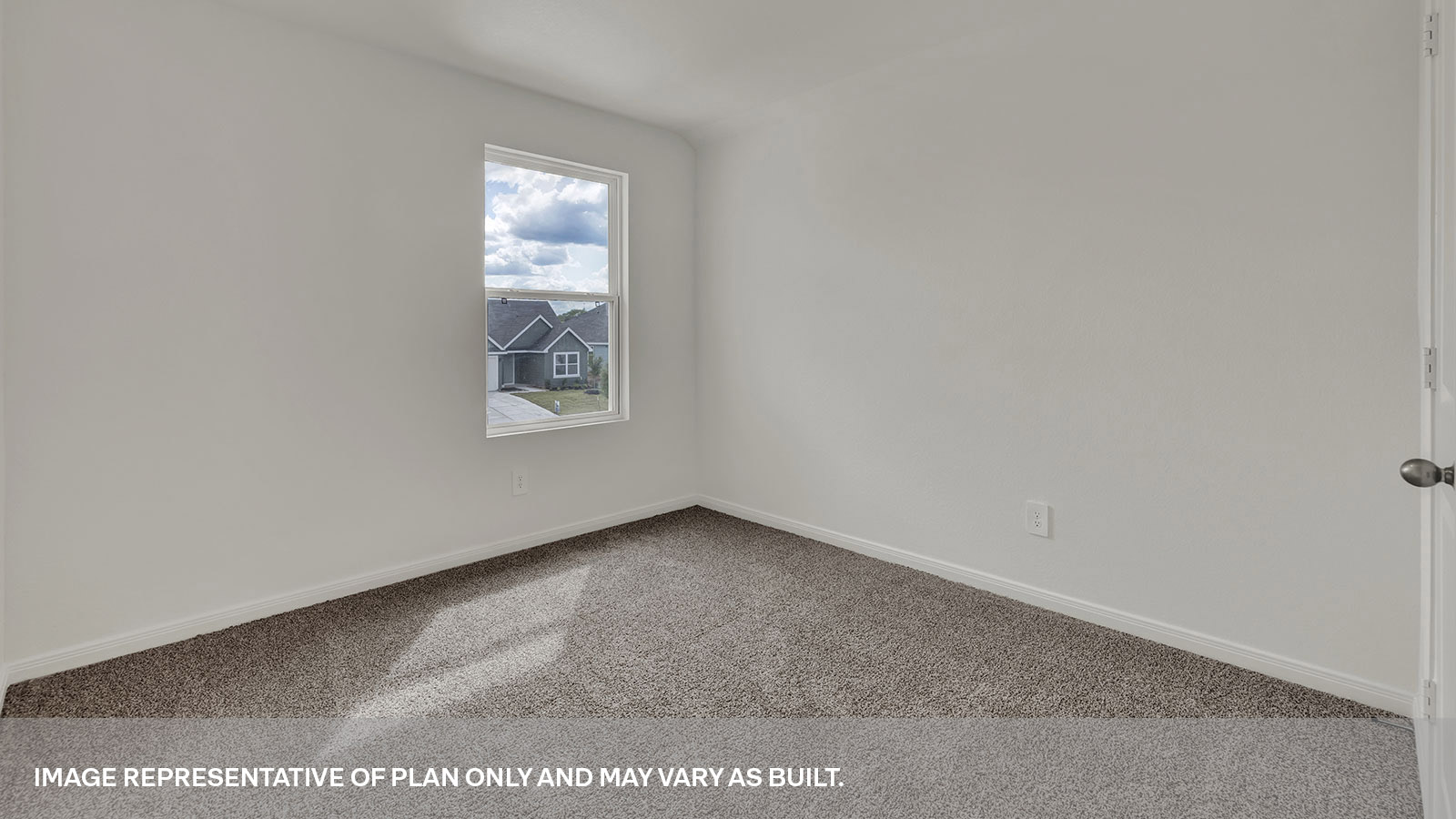 Bedroom with carpeting and one window.