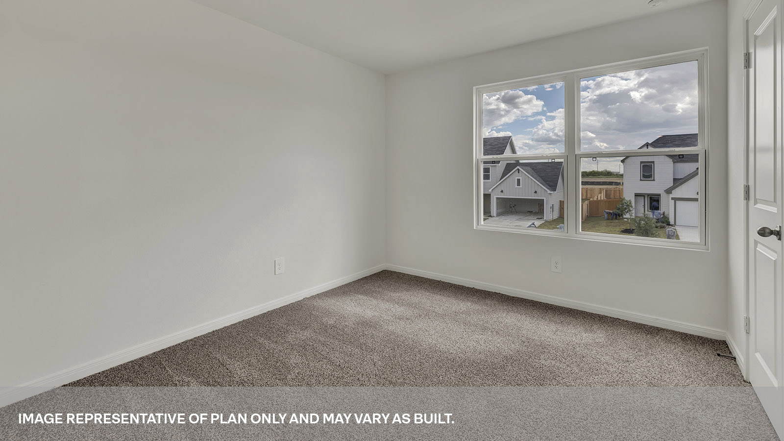 Bedroom with carpeting and one window.