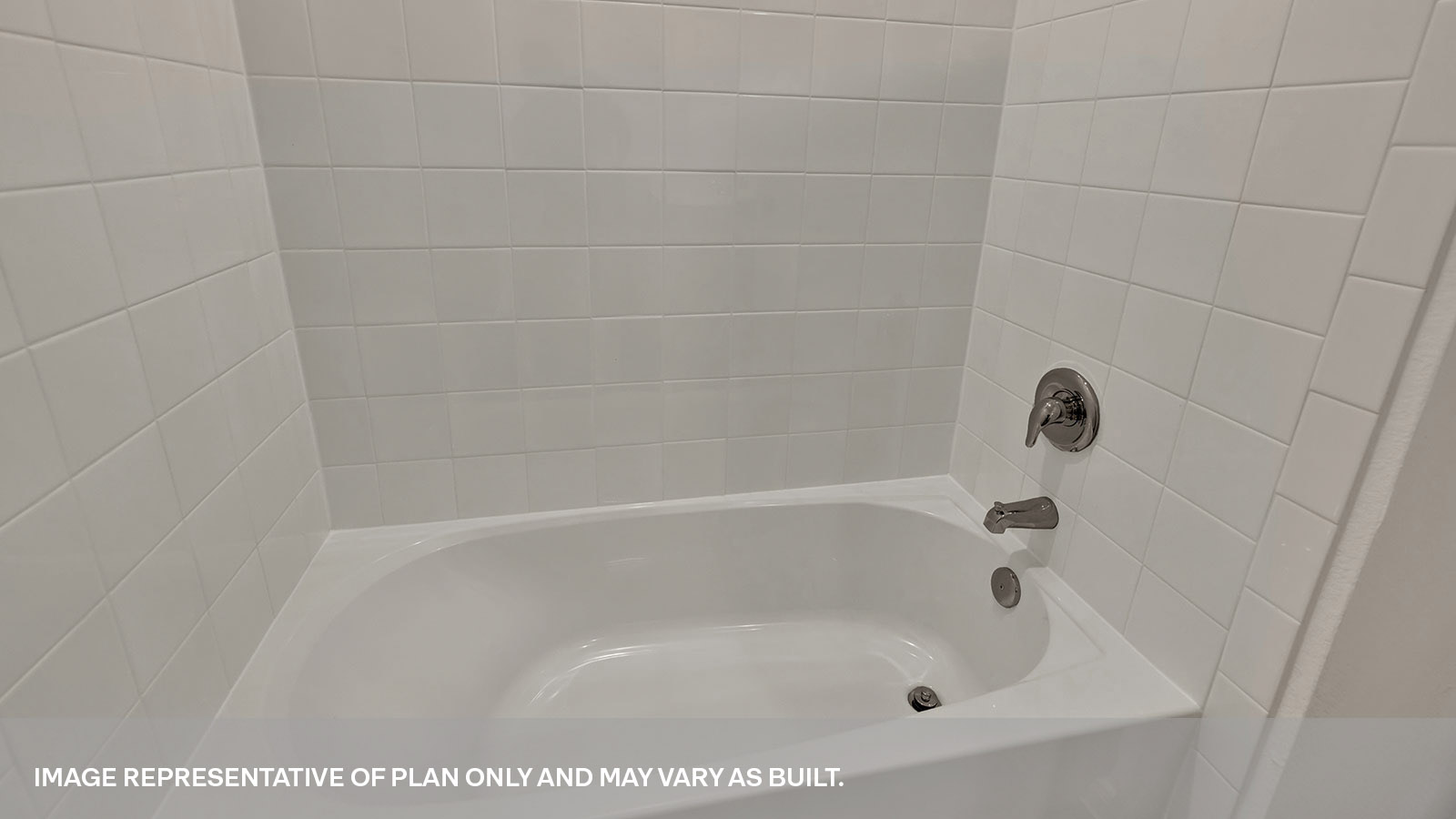 Bathroom with single sink vanity and toilet.