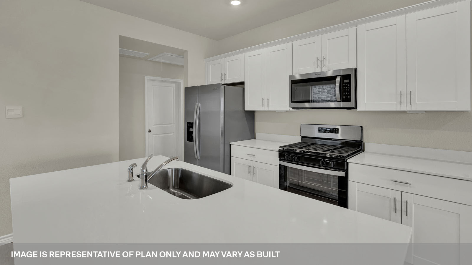 Kitchen with kitchen island and quartz countertops.