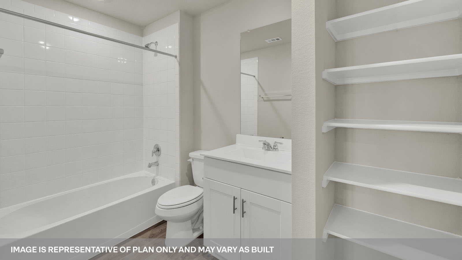 Hall bathroom with wooden shelving, vanity, toilet, and tub.