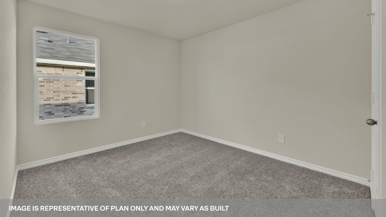 Bedroom with carpeting and one window.