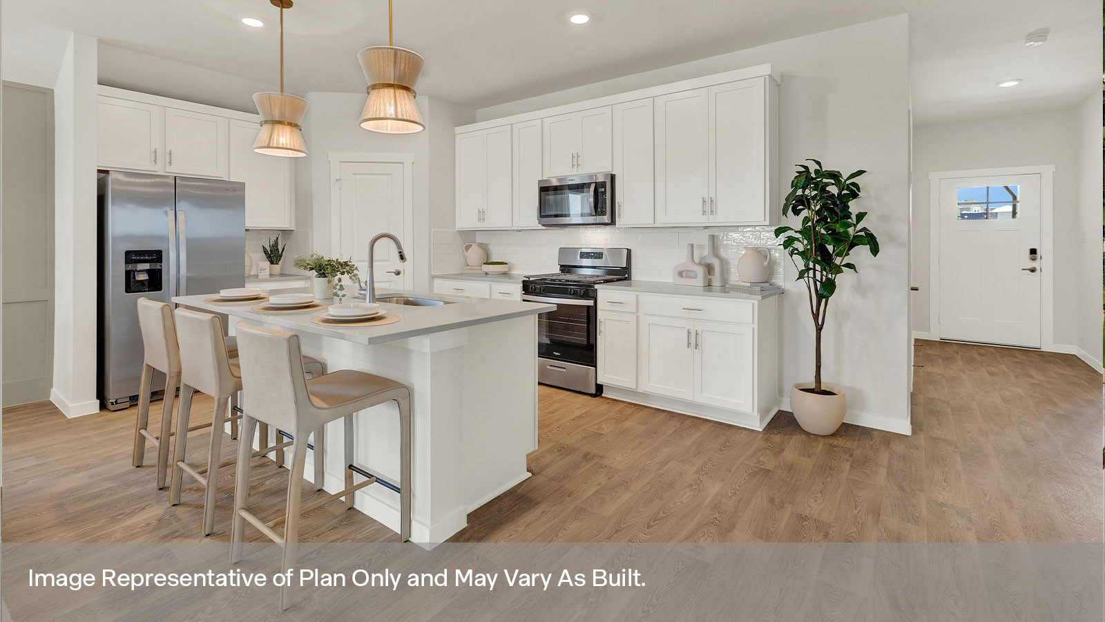 Entry hallway leading to the kitchen and kitchen island.