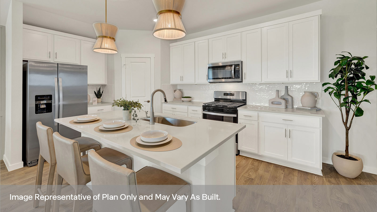 Kitchen with kitchen island and white cabinets.