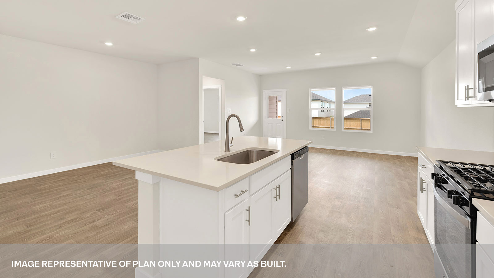 Kitchen with kitchen island overlooking the dining room.