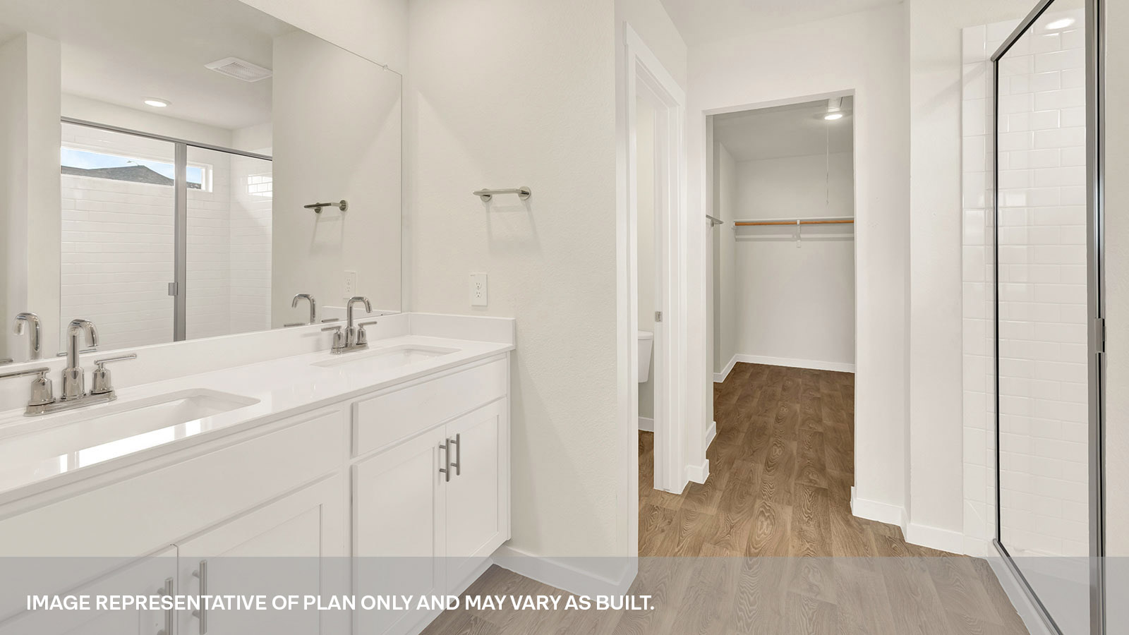 Main bathroom with vanity and walk-in shower.