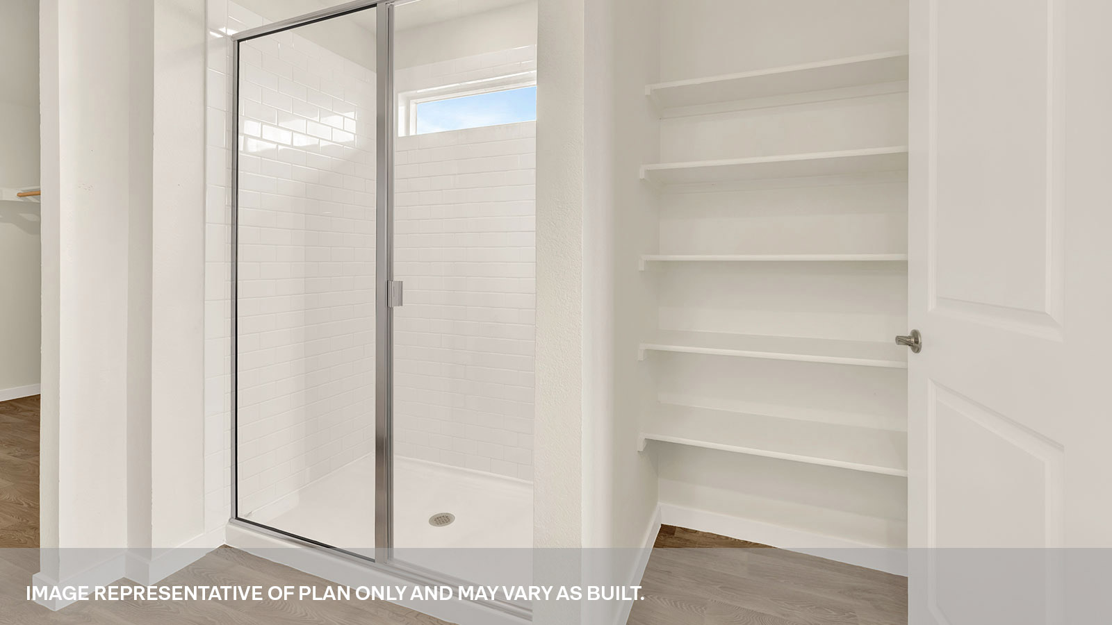 Main bathroom walk-in shower with shower glass door and wooden shelving.