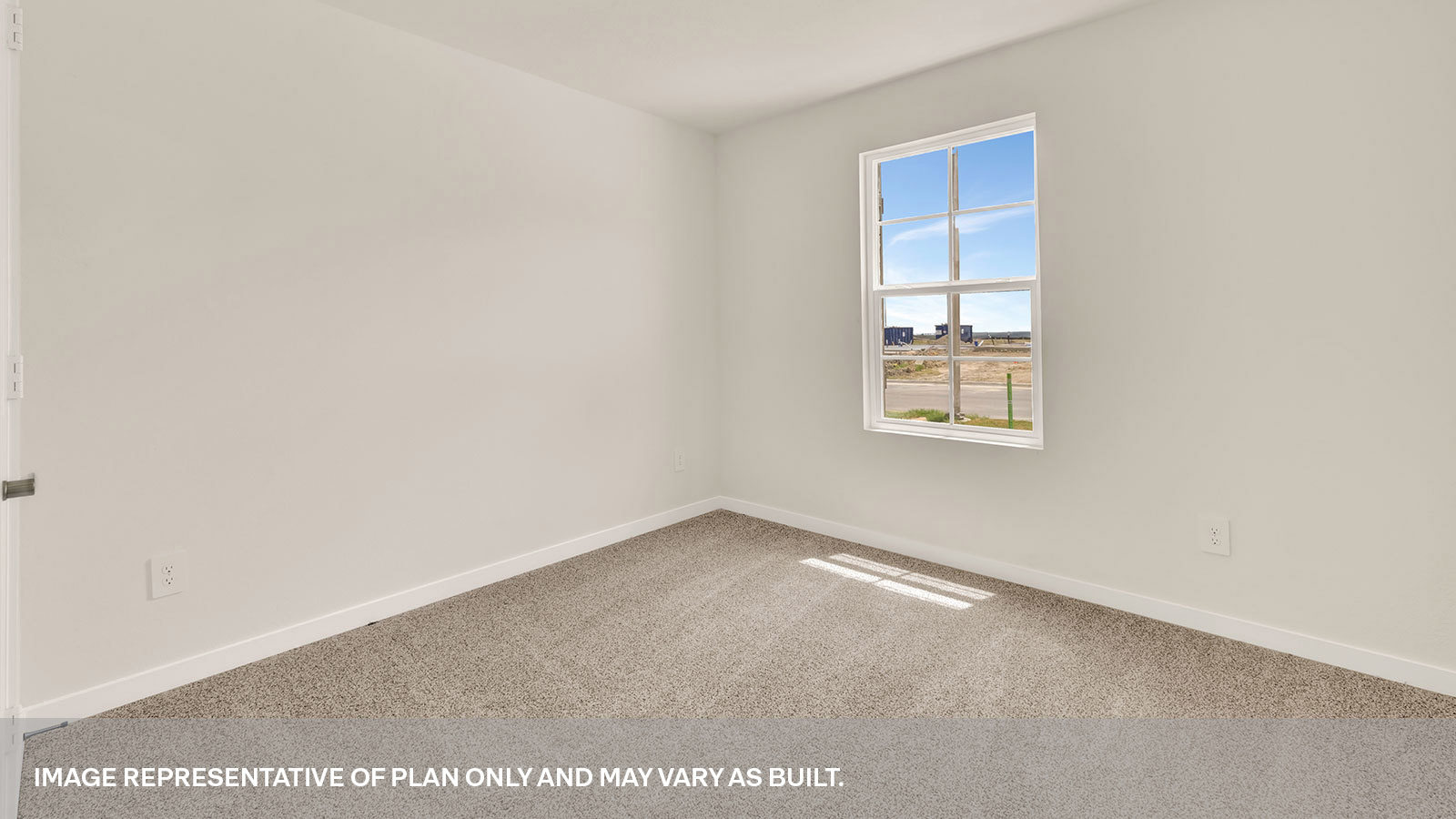Front bedroom with carpeting and one window.