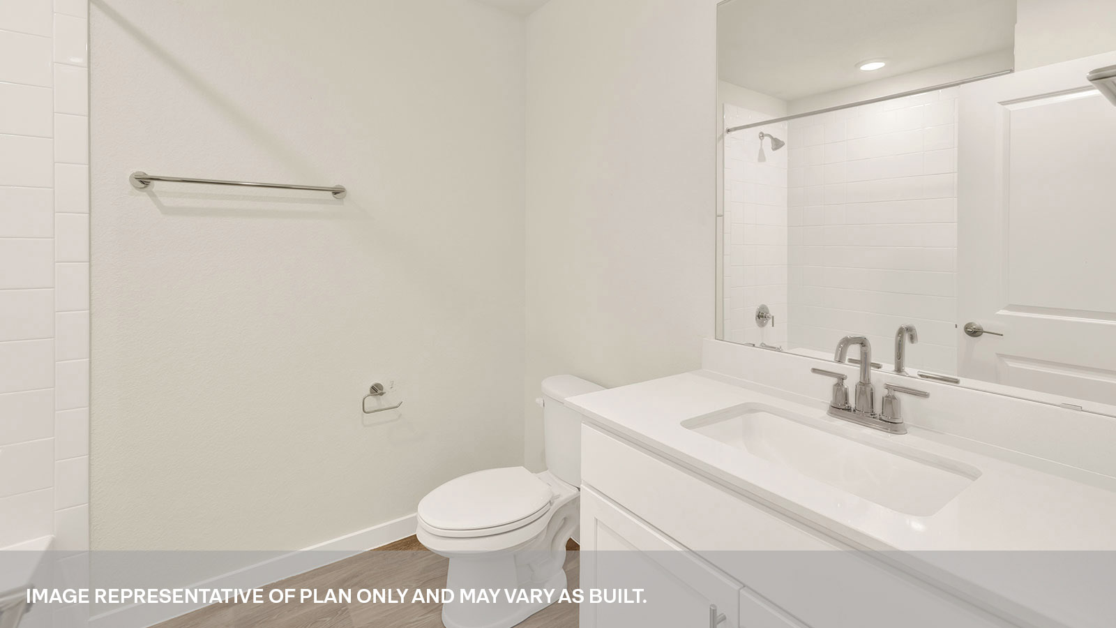 Hall bathroom with vanity and toilet.