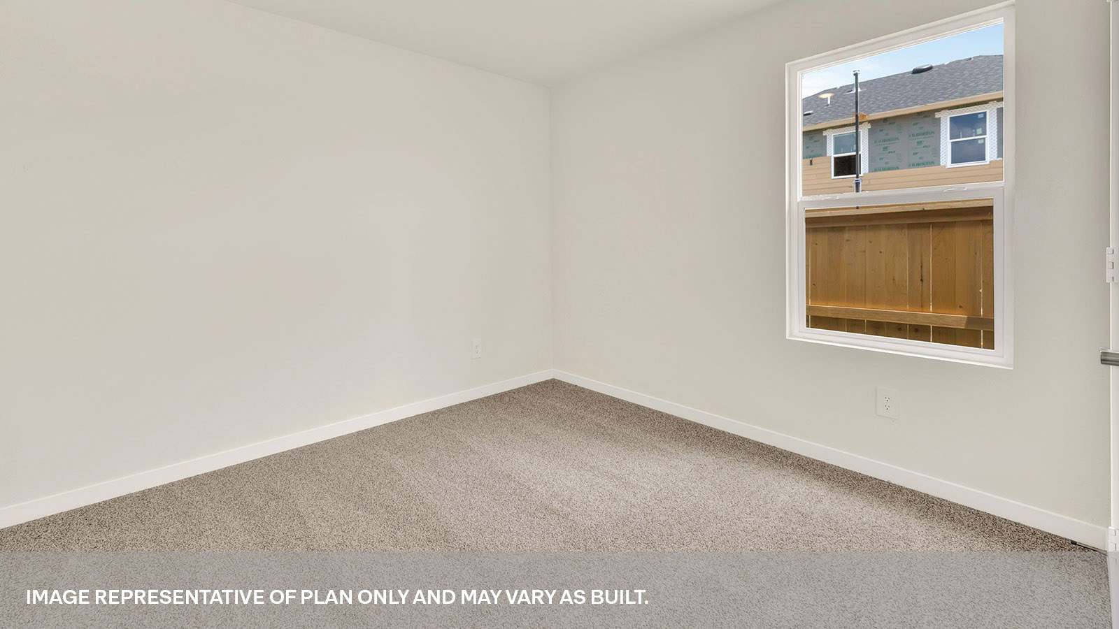 Secondary bedroom with carpeting and one window.