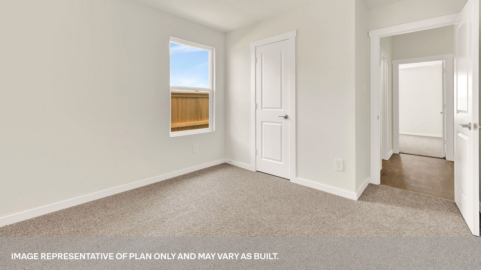 Secondary bedroom with carpeting and one window.