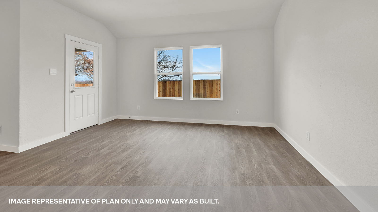 Dining room with vinyl flooring, two windows, and a half lite exterior door.
