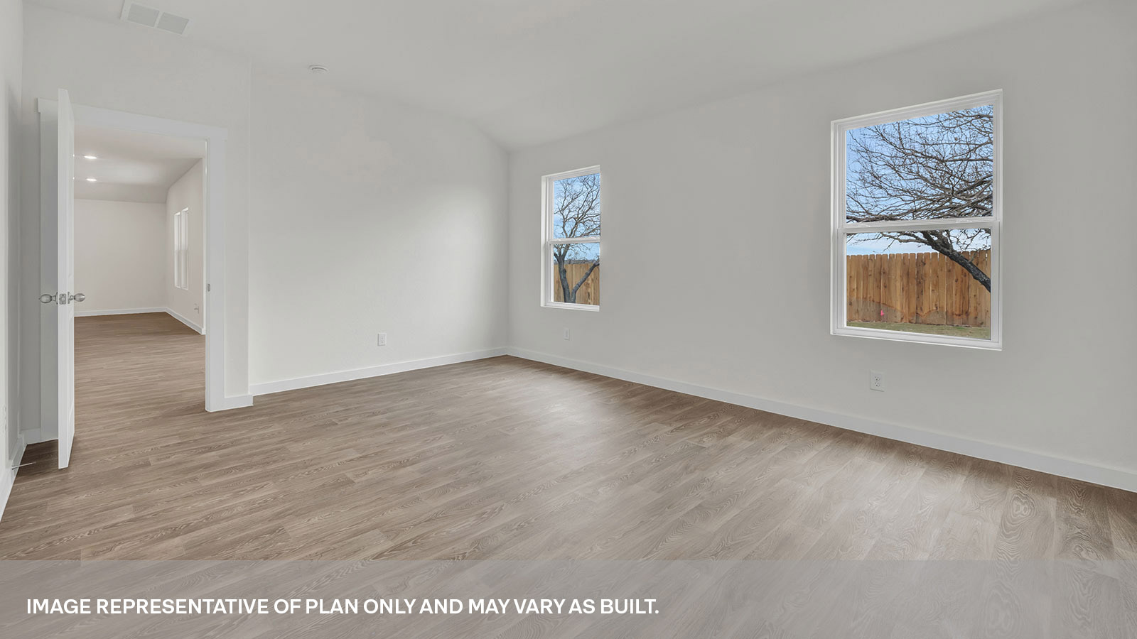 Main bedroom with vinyl flooring and two widnows.