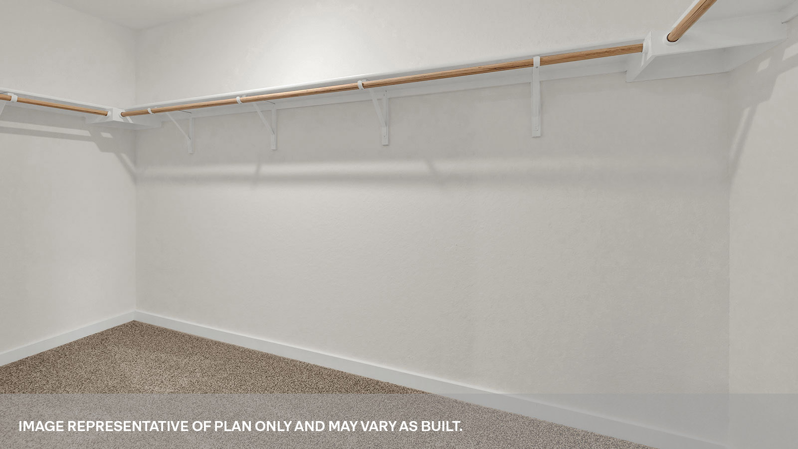 Main bedroom closet with carpeting and wooden shelving.