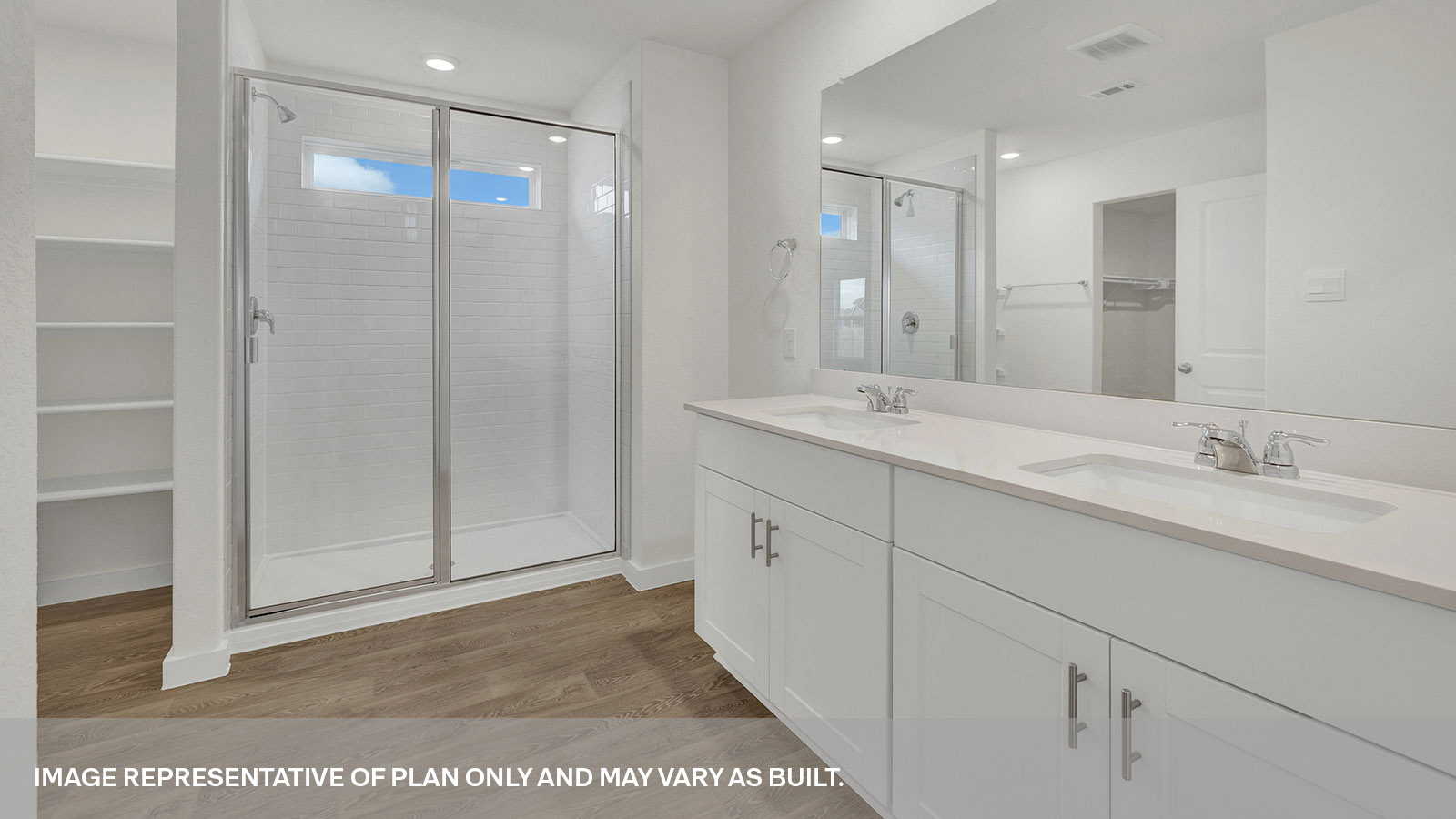 Main bathroom with vanity and walk-in shower with shower glass door.