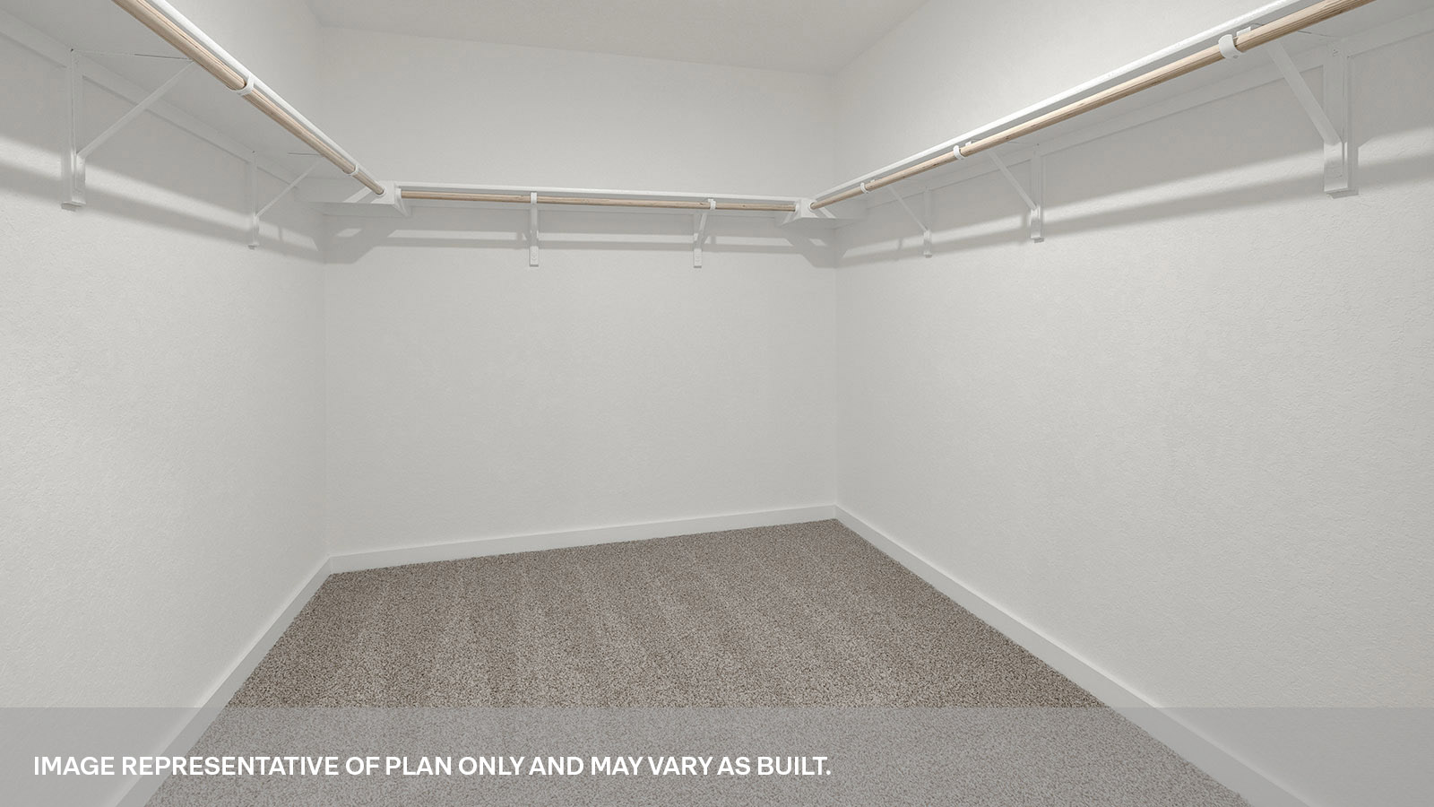 Main bedroom closet with carpeting and wooden shelving.