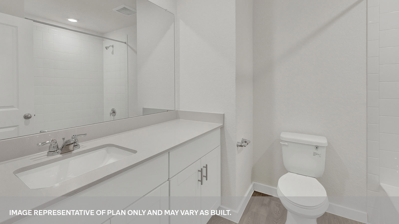 Hall bathroom with vanity and toilet.
