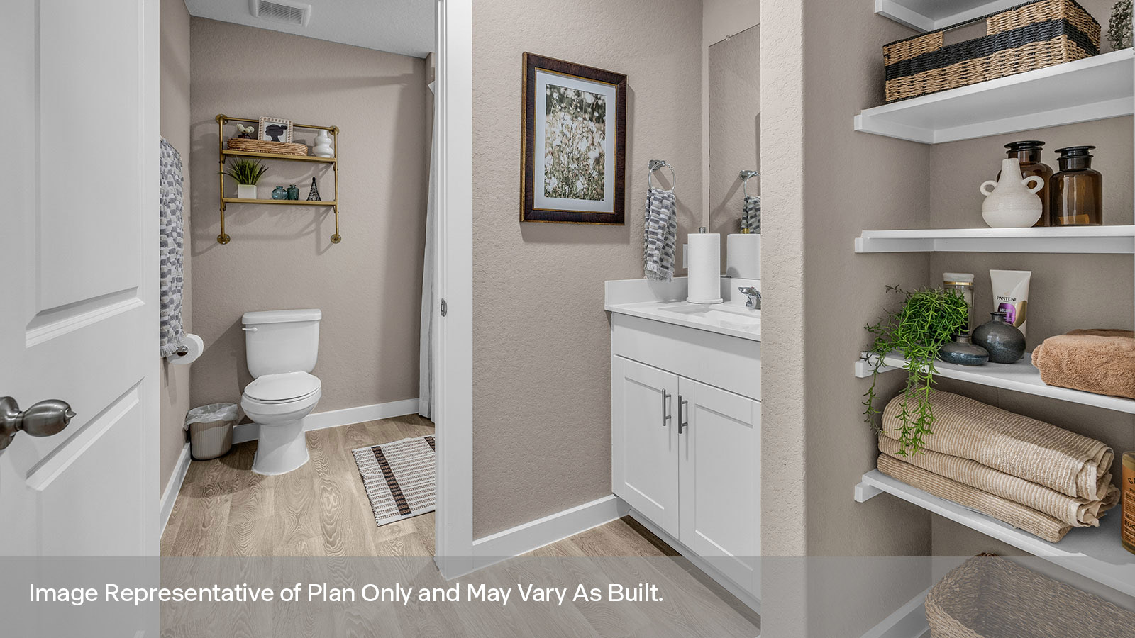 Hall bathroom with wooden shelving, vanity, and toilet.