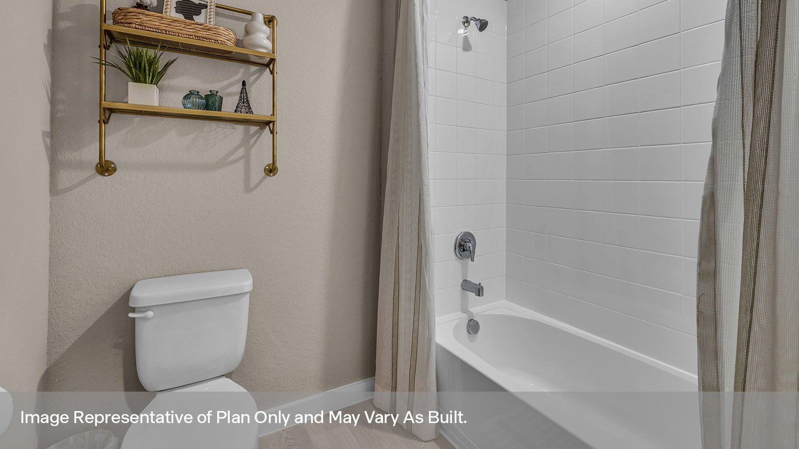 Hall bathroom with toilet and tub with tile surround.