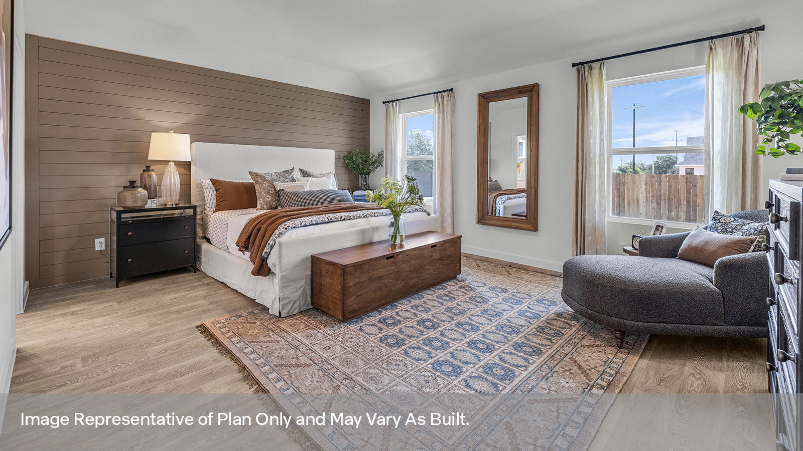Main bedroom with vinyl flooring and two windows.