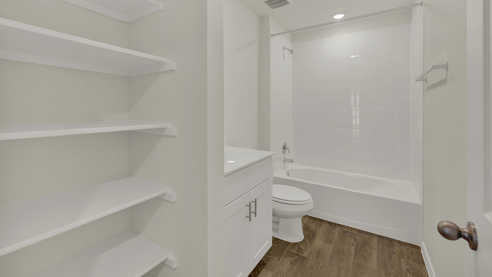 Owner’s ensuite vanity providing organized space for daily routines.